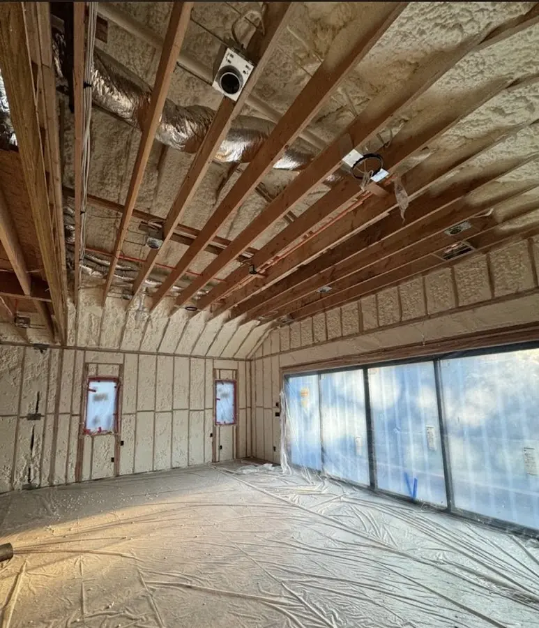 Interior walls and ceiling insulated with spray foam during new construction in Spout Springs